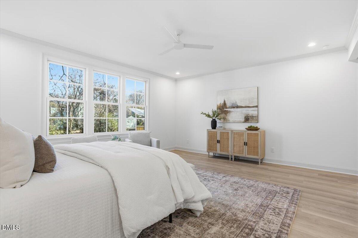 203 Baggett Avenue Raleigh, NC 27604 - Photo 23 of 51 a bedroom with a bed and a large window