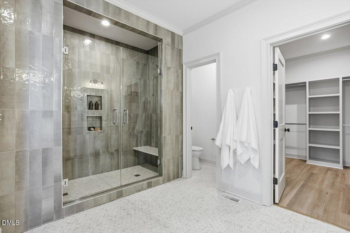 203 Baggett Avenue Raleigh, NC 27604 - Photo 25 of 51 a bathroom with a shower and a toilet