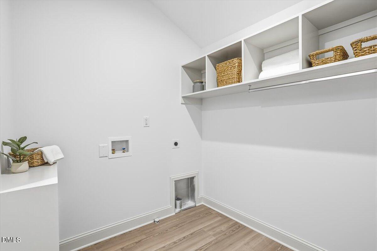 203 Baggett Avenue Raleigh, NC 27604 - Photo 32 of 45 a view of storage and utility room with wooden floor