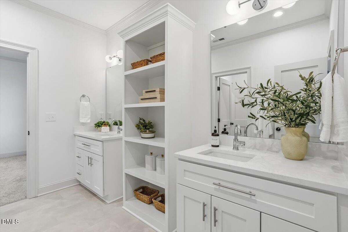 203 Baggett Avenue Raleigh, NC 27604 - Photo 34 of 51 a bathroom with sink and mirror