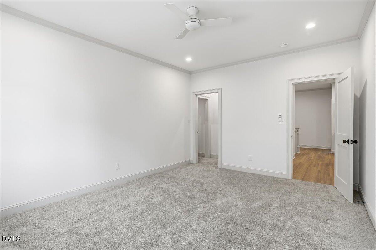 203 Baggett Avenue Raleigh, NC 27604 - Photo 40 of 51 an empty room with fan and entrance