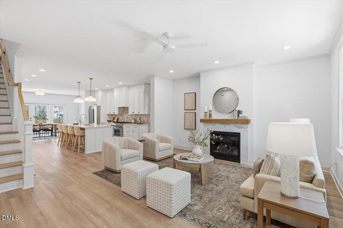 203 Baggett Avenue Raleigh, NC 27604 - Photo 5 of 45 a living room with furniture and a fireplace