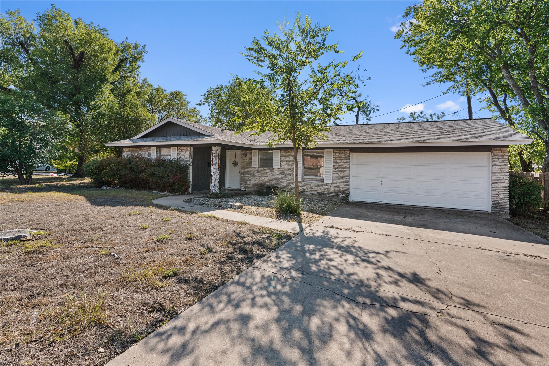 8204 Easter Cove Austin, TX 78757 - Photo 2 of 22 a front view of a house with a yard and garage