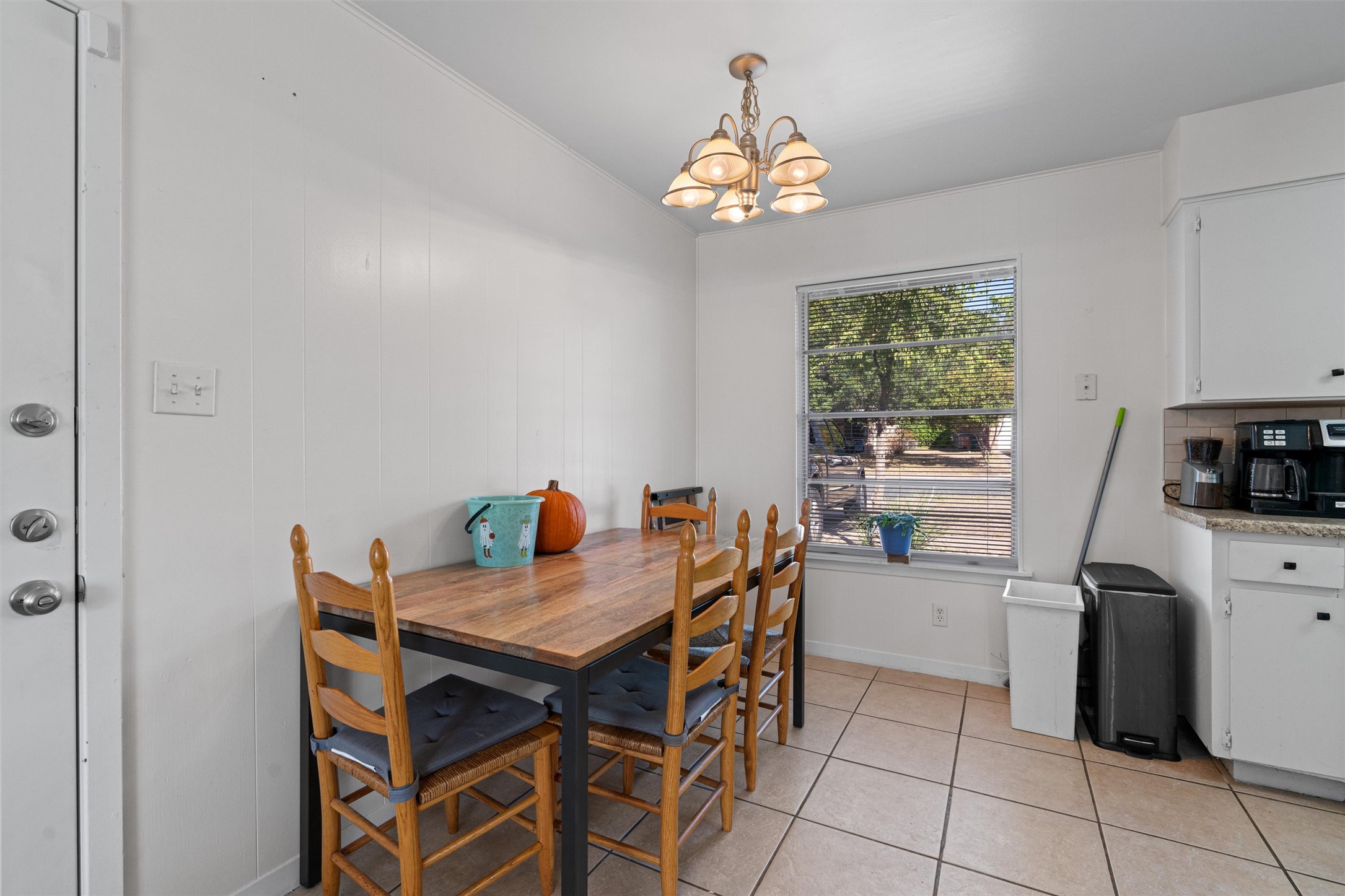 8204 Easter Cove Austin, TX 78757 - Photo 7 of 22 a view of a dining room with furniture and a chandelier