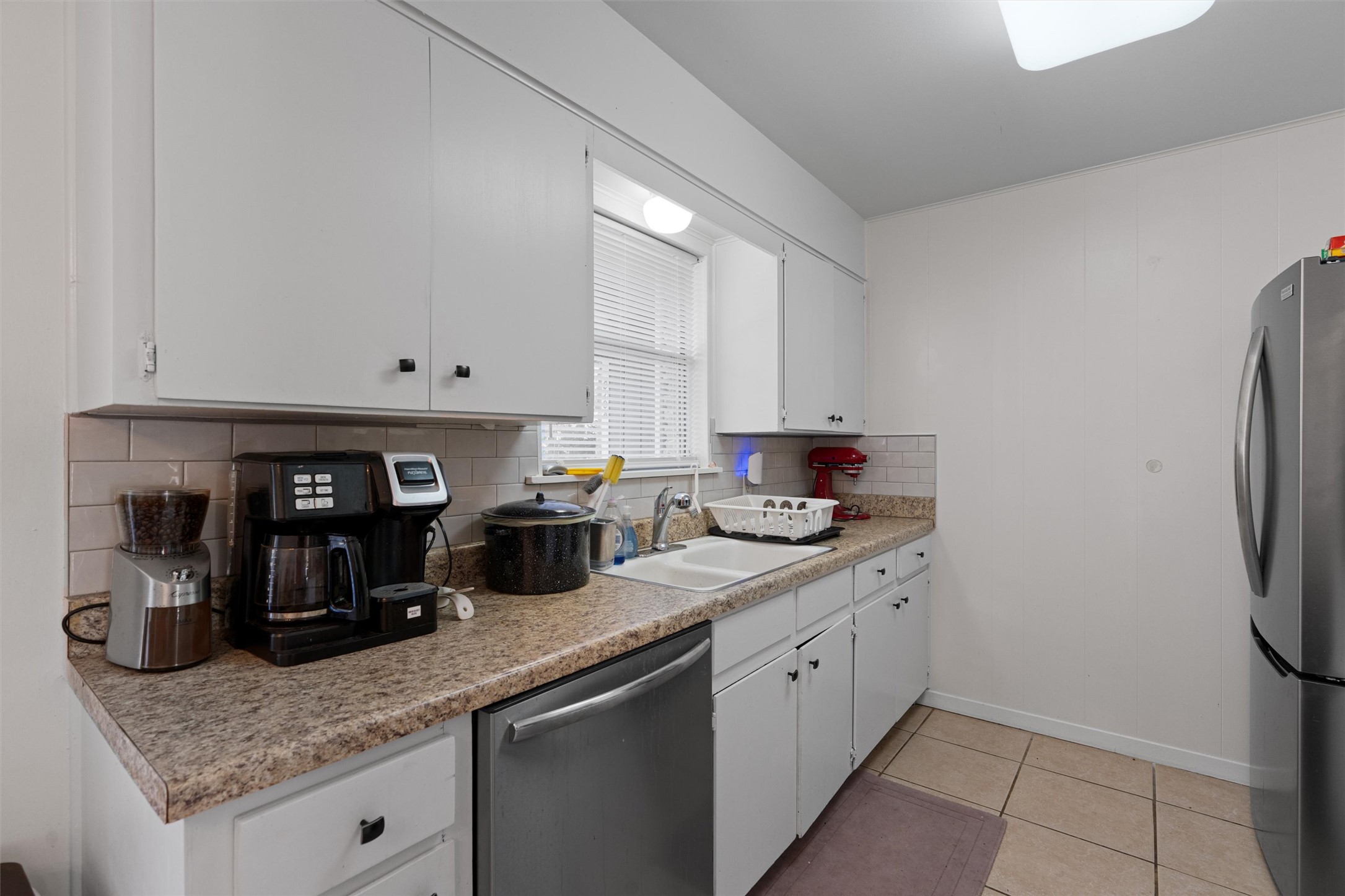 8204 Easter Cove Austin, TX 78757 - Photo 9 of 22 a kitchen with stainless steel appliances granite countertop a sink and cabinets