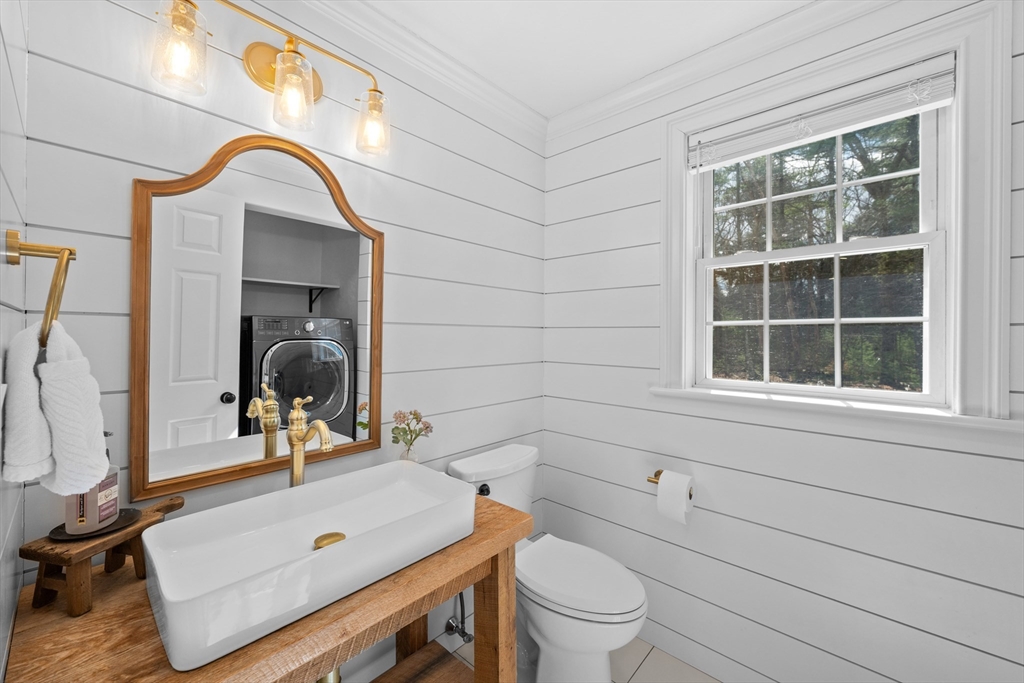 8 Virginia Avenue Sutton, MA 01590 - Photo 12 of 38 a bathroom with a sink and a mirror