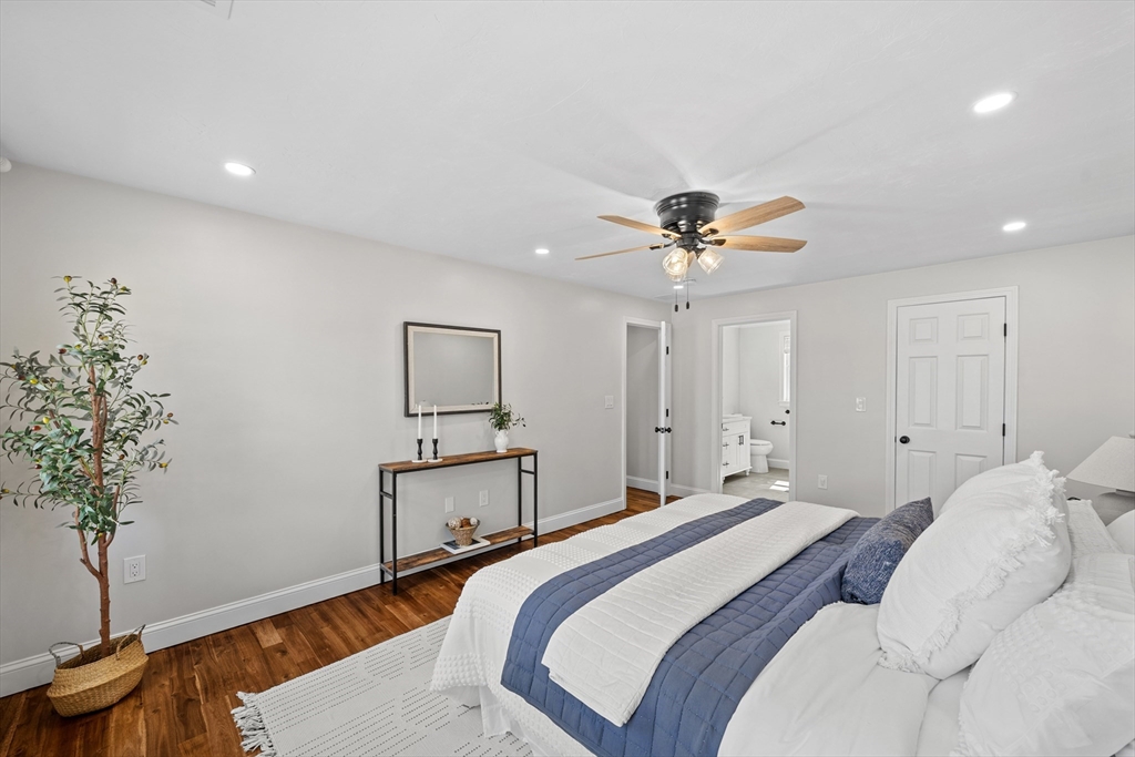 8 Virginia Avenue Sutton, MA 01590 - Photo 17 of 38 a bedroom with a bed and a potted plant