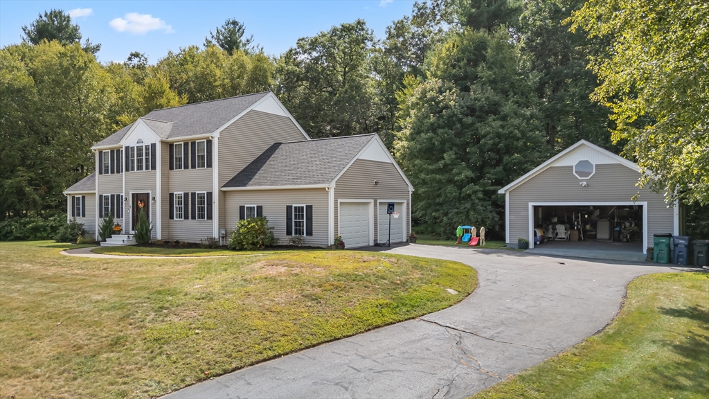 8 Virginia Avenue Sutton, MA 01590 - Photo 2 of 38 a view of a white house with a yard