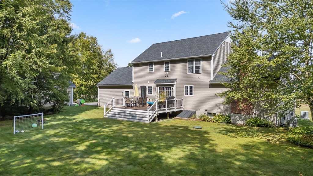 8 Virginia Avenue Sutton, MA 01590 - Photo 33 of 38 a front view of a house with a garden