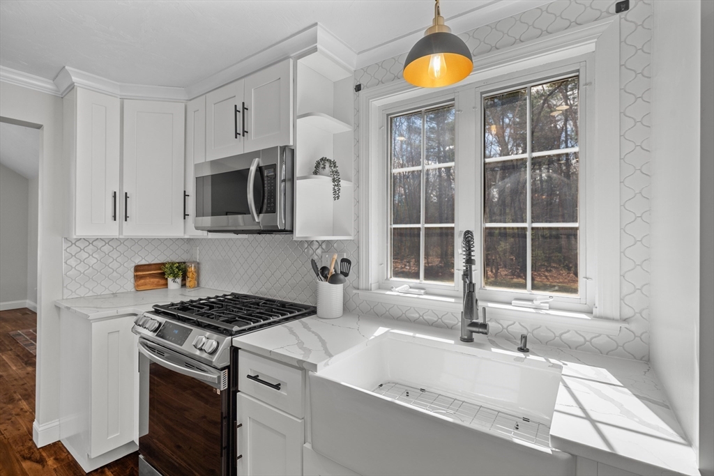 8 Virginia Avenue Sutton, MA 01590 - Photo 9 of 38 a kitchen that has a sink and a stove