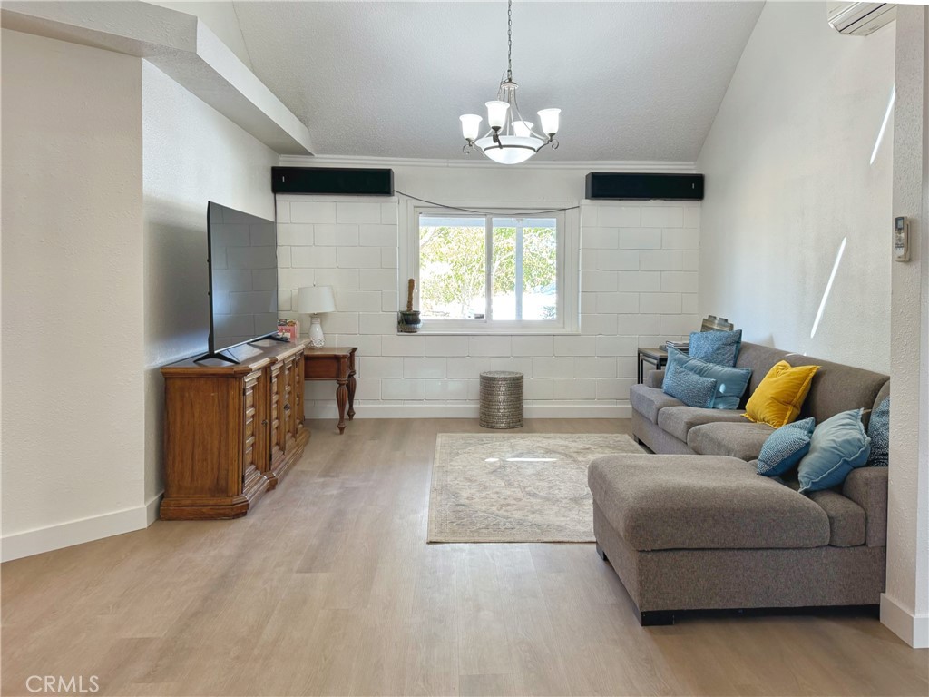 65585 4th Street South Joshua Tree, CA 92252 - Photo 14 of 27 a living room with furniture and a flat screen tv