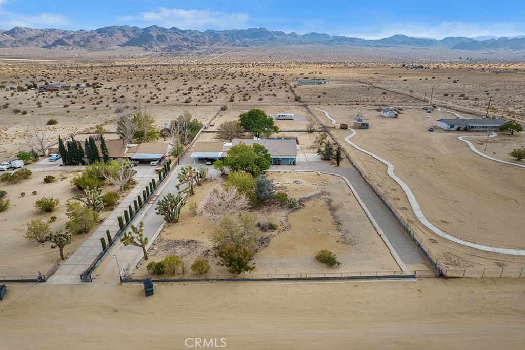 65585 4th Street South Joshua Tree, CA 92252 - Photo 16 of 27 an aerial view of residential houses with outdoor space