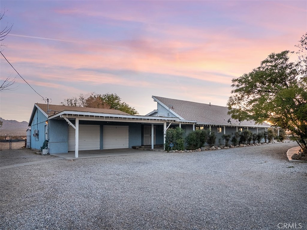 65585 4th Street South Joshua Tree, CA 92252 - Photo 27 of 27 a view of a house with a yard and large tree
