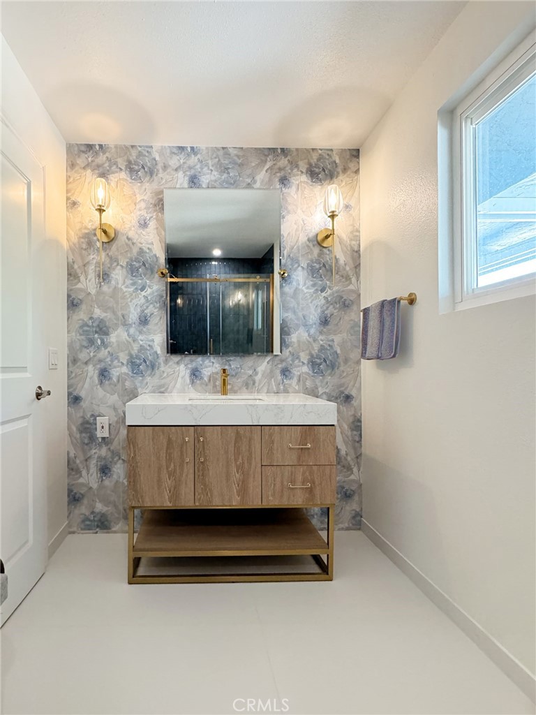 65585 4th Street South Joshua Tree, CA 92252 - Photo 5 of 27 a bathroom with a sink a mirror and a toilet