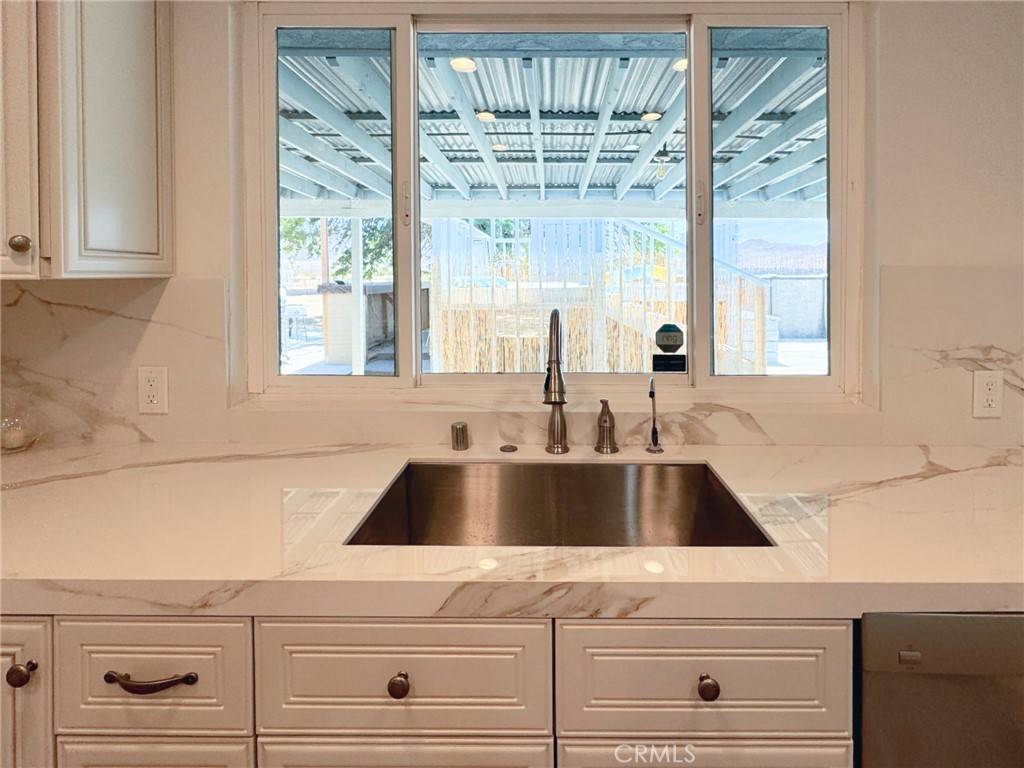 65585 4th Street South Joshua Tree, CA 92252 - Photo 9 of 27 a close view of sink and tap