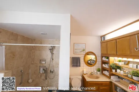 a bathroom with a sink a mirror and a shower