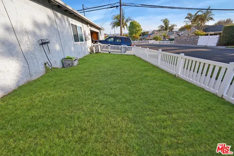 a view of a back yard of the house