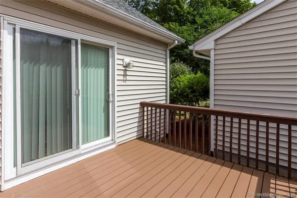 a view of a balcony with wooden floor