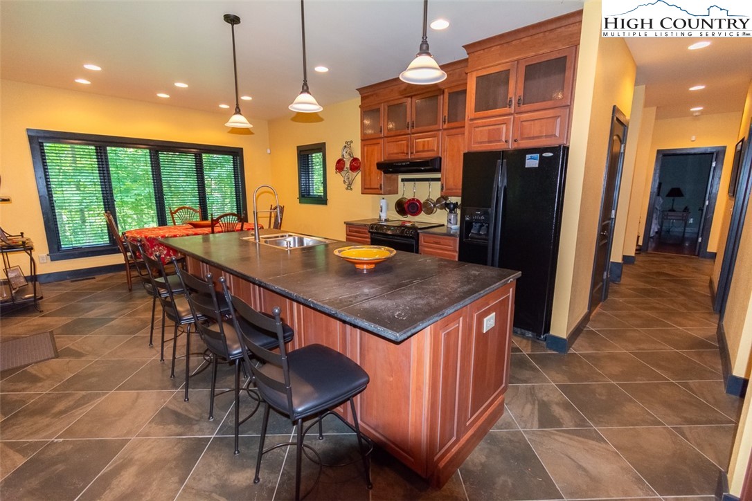 572 Stonegate Lane Creston, NC 28615 - Photo 14 of 48 a view of a dining table and chairs
