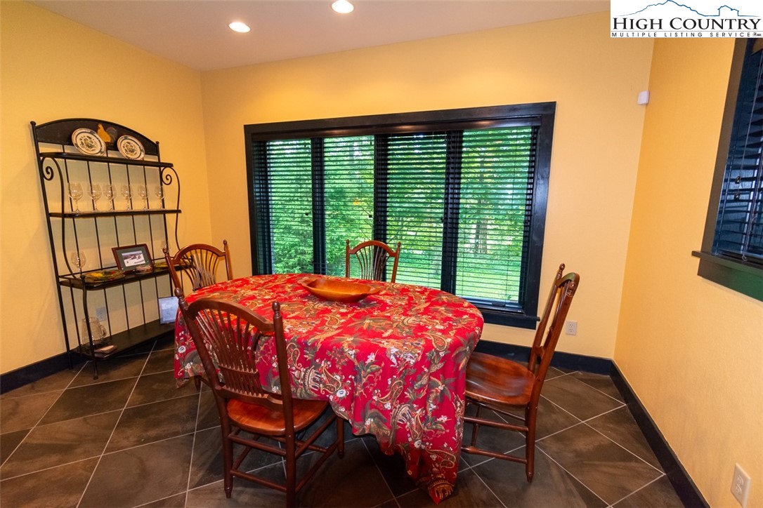 572 Stonegate Lane Creston, NC 28615 - Photo 16 of 48 a patio with table and chairs