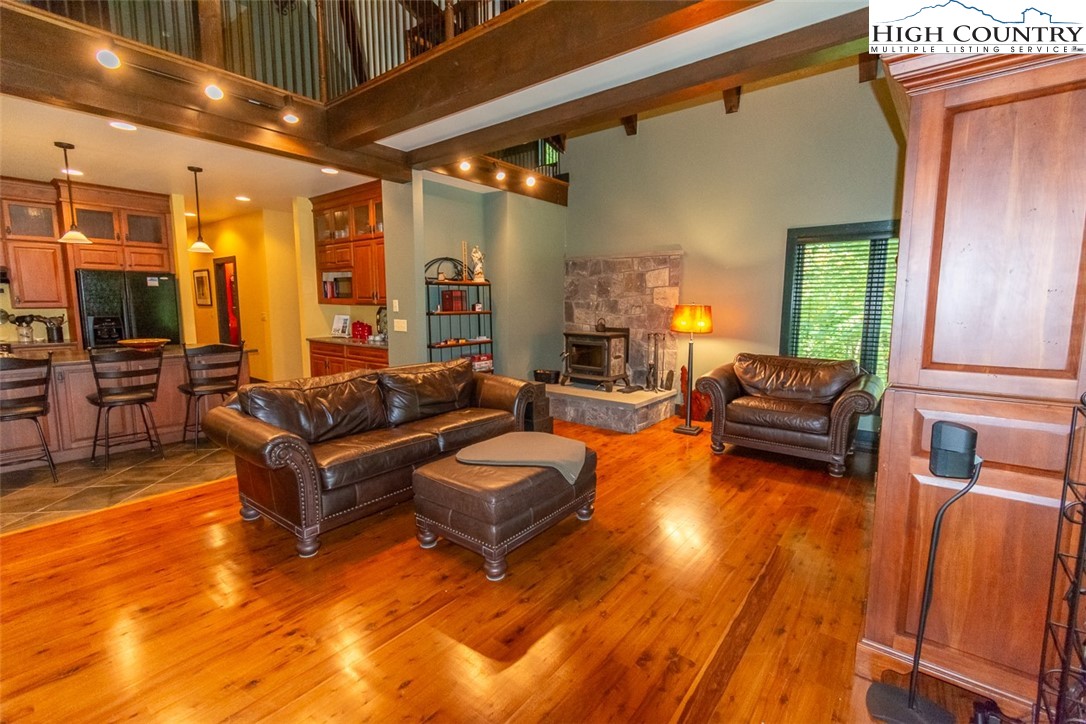 572 Stonegate Lane Creston, NC 28615 - Photo 20 of 48 a living room with furniture and a large window