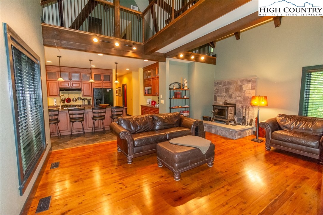 572 Stonegate Lane Creston, NC 28615 - Photo 21 of 48 a living room with furniture and a pool