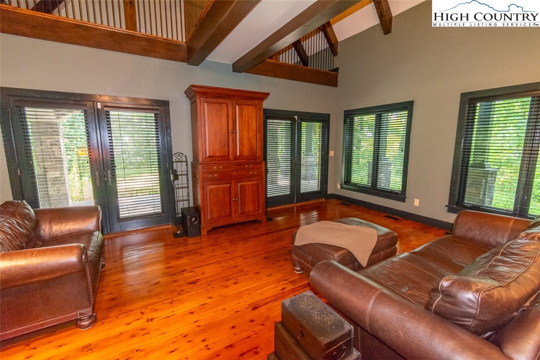 572 Stonegate Lane Creston, NC 28615 - Photo 22 of 48 a living room with furniture and windows