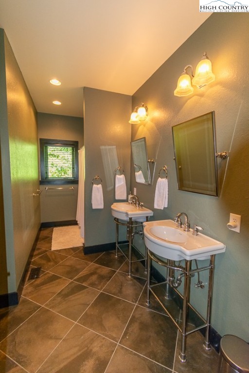 572 Stonegate Lane Creston, NC 28615 - Photo 26 of 48 a bathroom with a sink a mirror and a shower