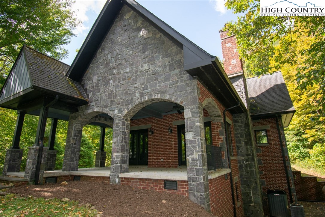572 Stonegate Lane Creston, NC 28615 - Photo 3 of 48 a front view of a house with garden
