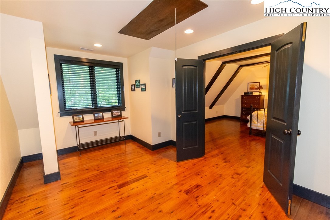 572 Stonegate Lane Creston, NC 28615 - Photo 31 of 48 a view of a hallway with furniture and floor to ceiling window