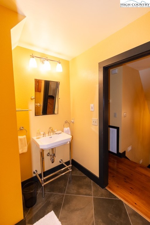 572 Stonegate Lane Creston, NC 28615 - Photo 36 of 48 a bathroom with a sink and a mirror