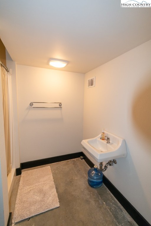 572 Stonegate Lane Creston, NC 28615 - Photo 43 of 48 a bathroom with a sink