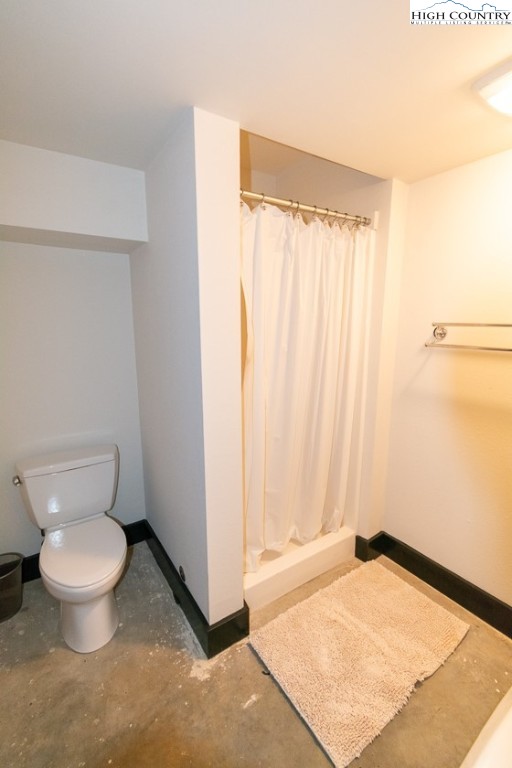 572 Stonegate Lane Creston, NC 28615 - Photo 44 of 48 a bathroom with a toilet a sink and a window