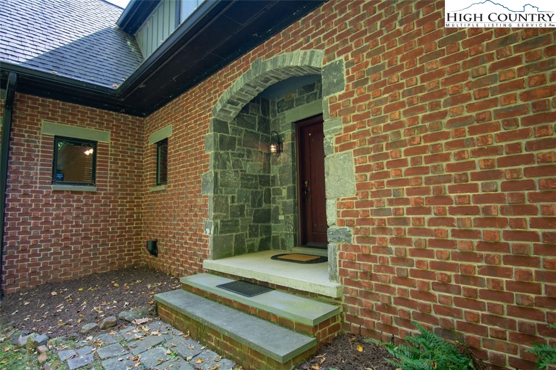 572 Stonegate Lane Creston, NC 28615 - Photo 5 of 48 a view of a brick house with a door