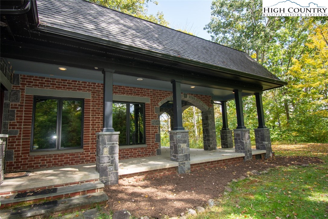 572 Stonegate Lane Creston, NC 28615 - Photo 6 of 48 a view of a house with a porch