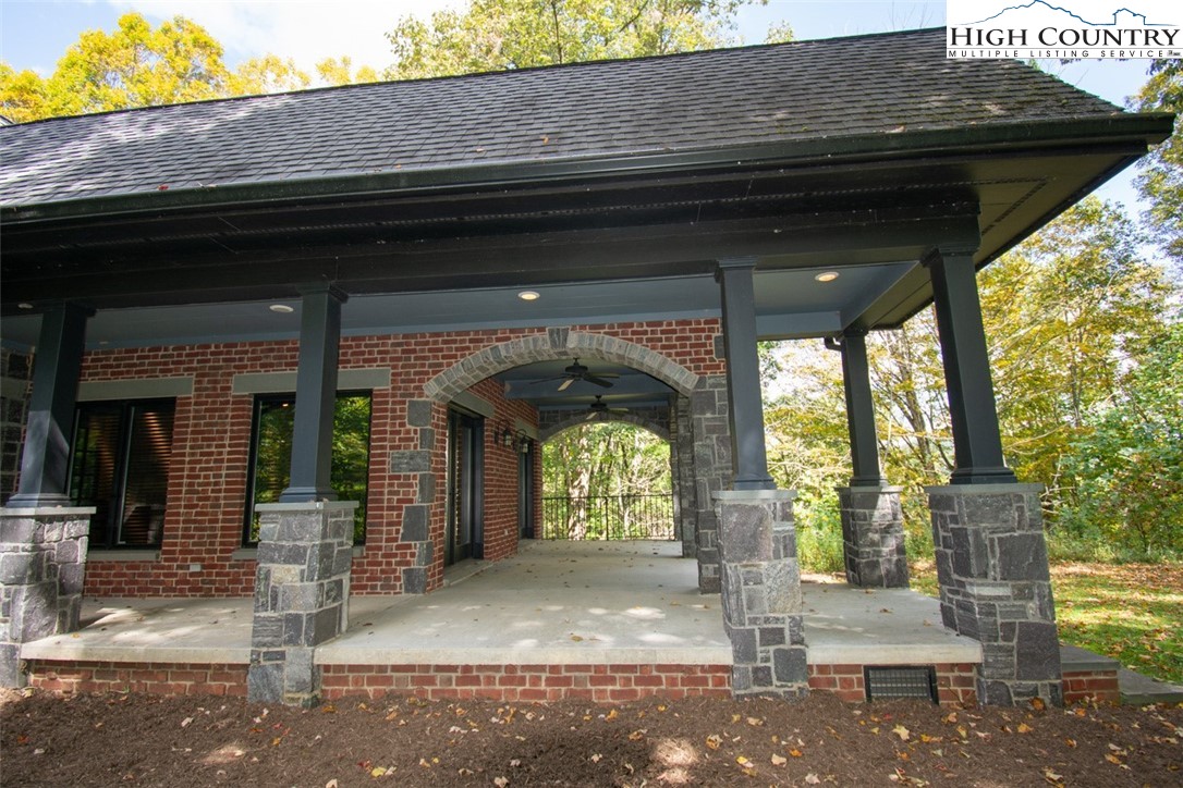 572 Stonegate Lane Creston, NC 28615 - Photo 7 of 48 a front view of a house with a garden