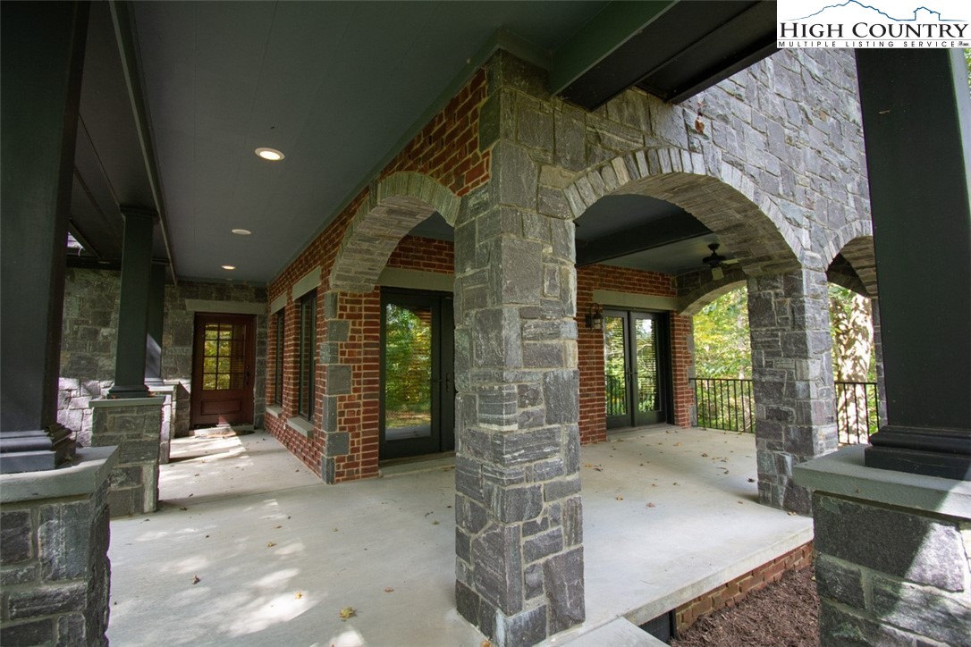 572 Stonegate Lane Creston, NC 28615 - Photo 8 of 48 a view of entrance with fireplace and window