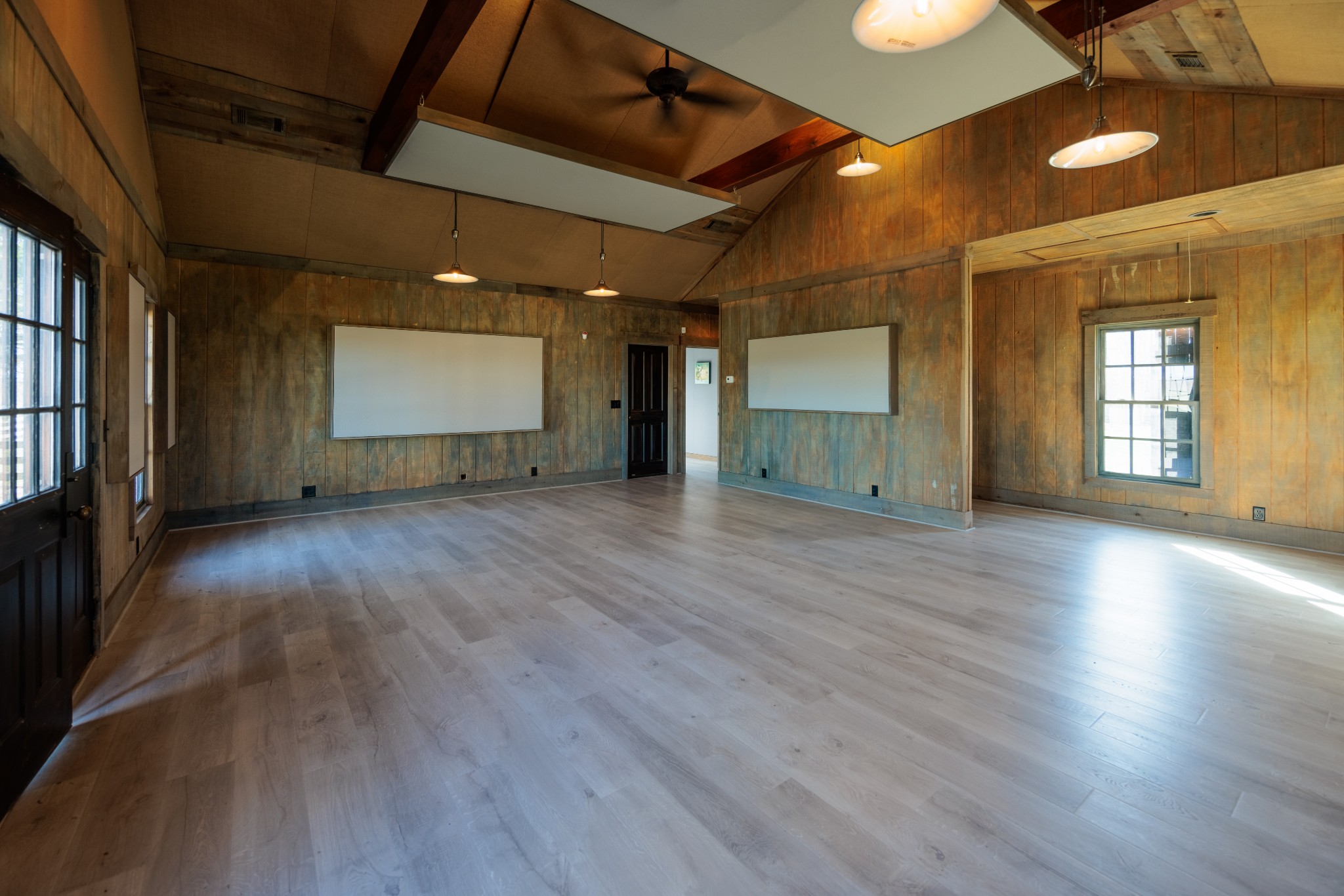 7776 Lampley Road Primm Springs, TN 38476 - Photo 25 of 50 an empty room with wooden floor and windows