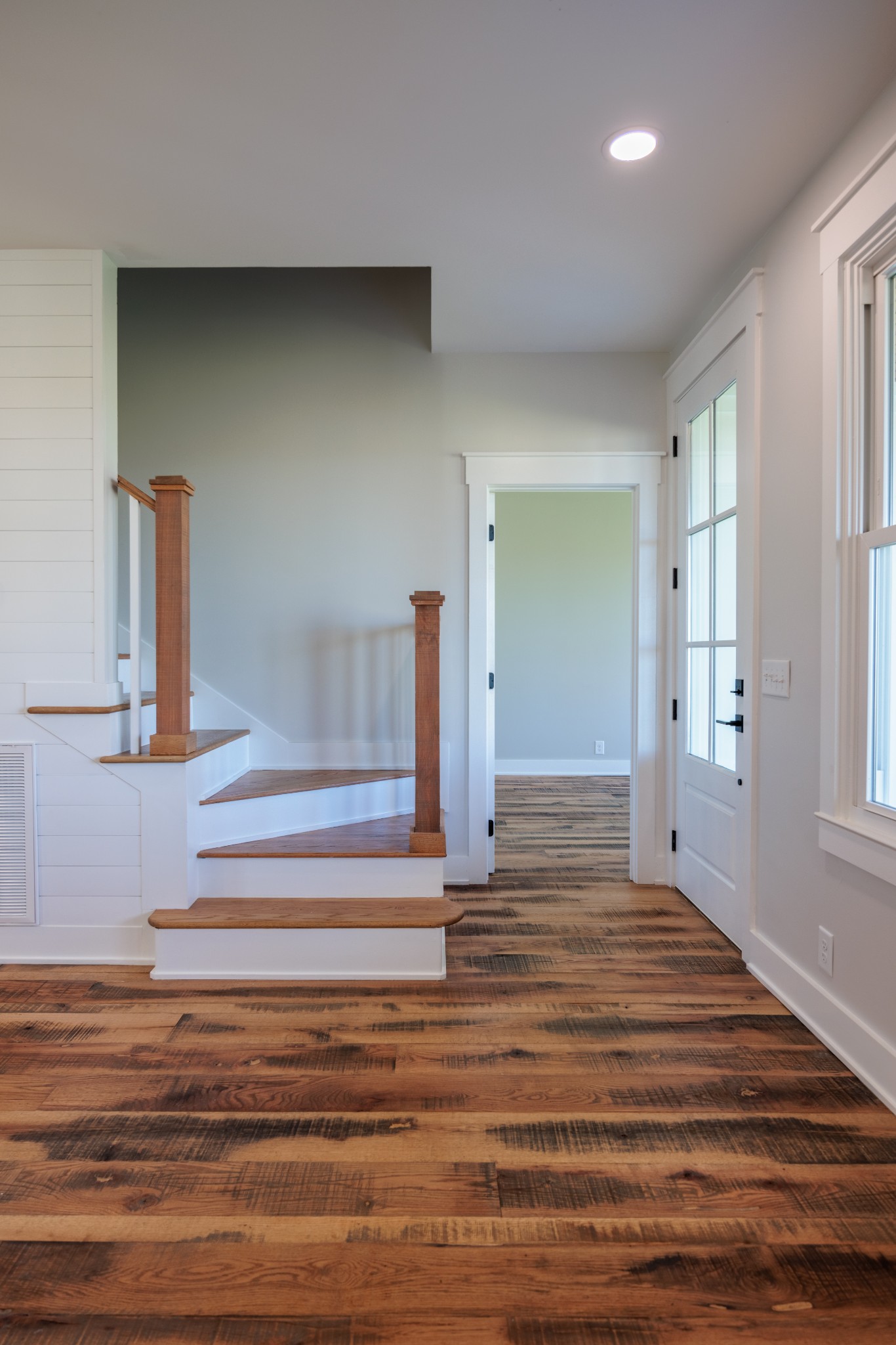 7776 Lampley Road Primm Springs, TN 38476 - Photo 29 of 50 a view of a livingroom with wooden floor and stairs