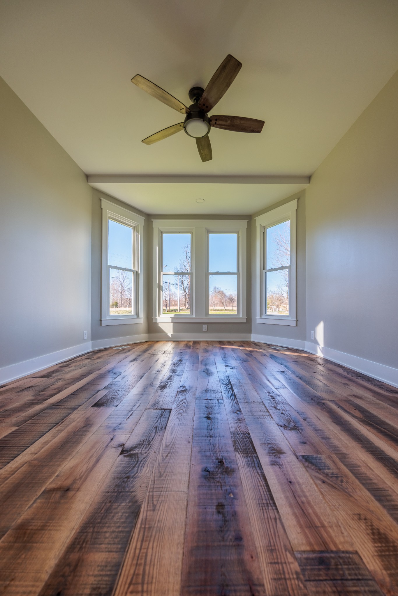7776 Lampley Road Primm Springs, TN 38476 - Photo 30 of 50 a view of empty room with wooden floor and fan