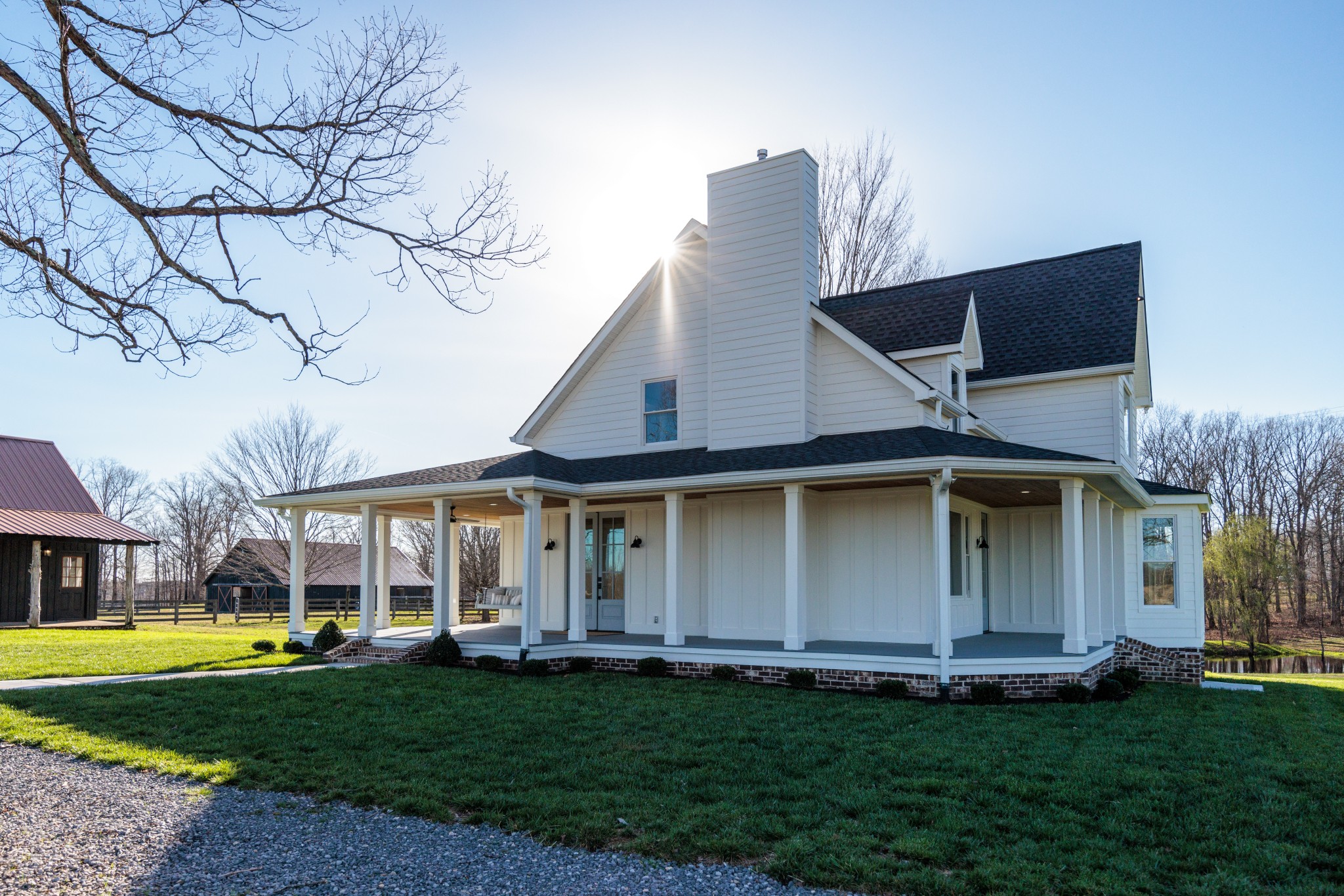 7776 Lampley Road Primm Springs, TN 38476 - Photo 6 of 50 a front view of a house with a garden
