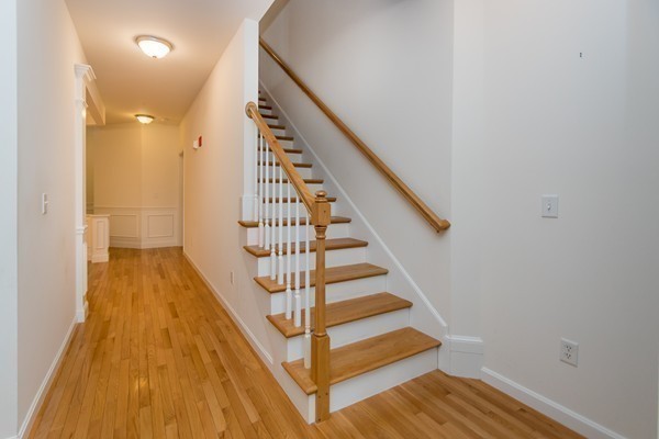 16 Bartlett Way, Unit 3 Waltham, MA 02452 - Photo 15 of 30 a view of entryway with wooden floor