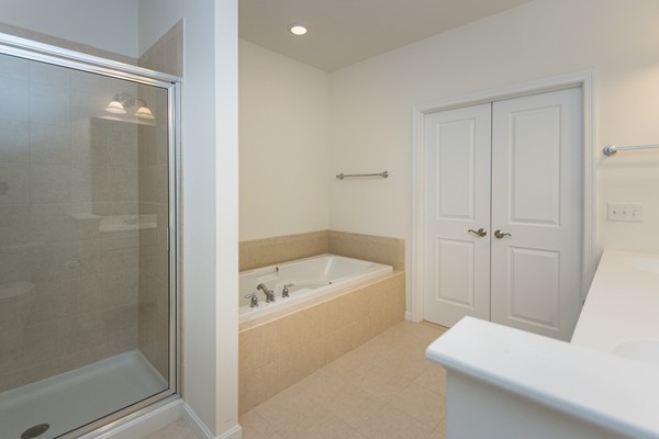 16 Bartlett Way, Unit 3 Waltham, MA 02452 - Photo 18 of 30 a bathroom with a tub a toilet and a sink