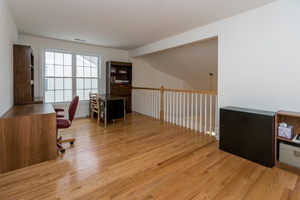 16 Bartlett Way, Unit 3 Waltham, MA 02452 - Photo 21 of 30 a living room with furniture window and wooden floor
