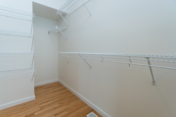 16 Bartlett Way, Unit 3 Waltham, MA 02452 - Photo 23 of 30 a view of a room with racks on the wall