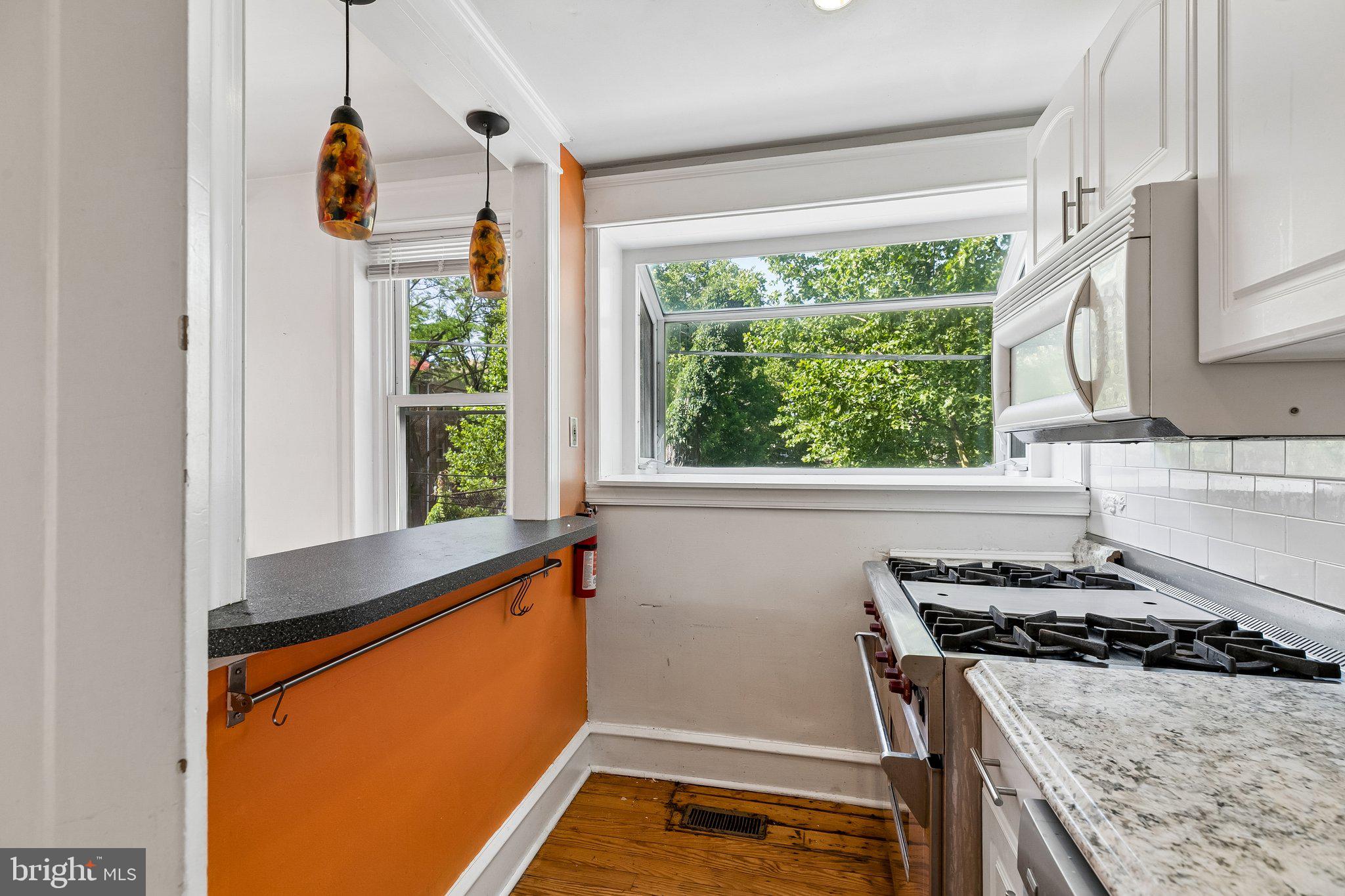 527 South 7th Street, Unit 1 Philadelphia, PA 19147 - Photo 10 of 33 Bright kitchen with vibrant accents.
