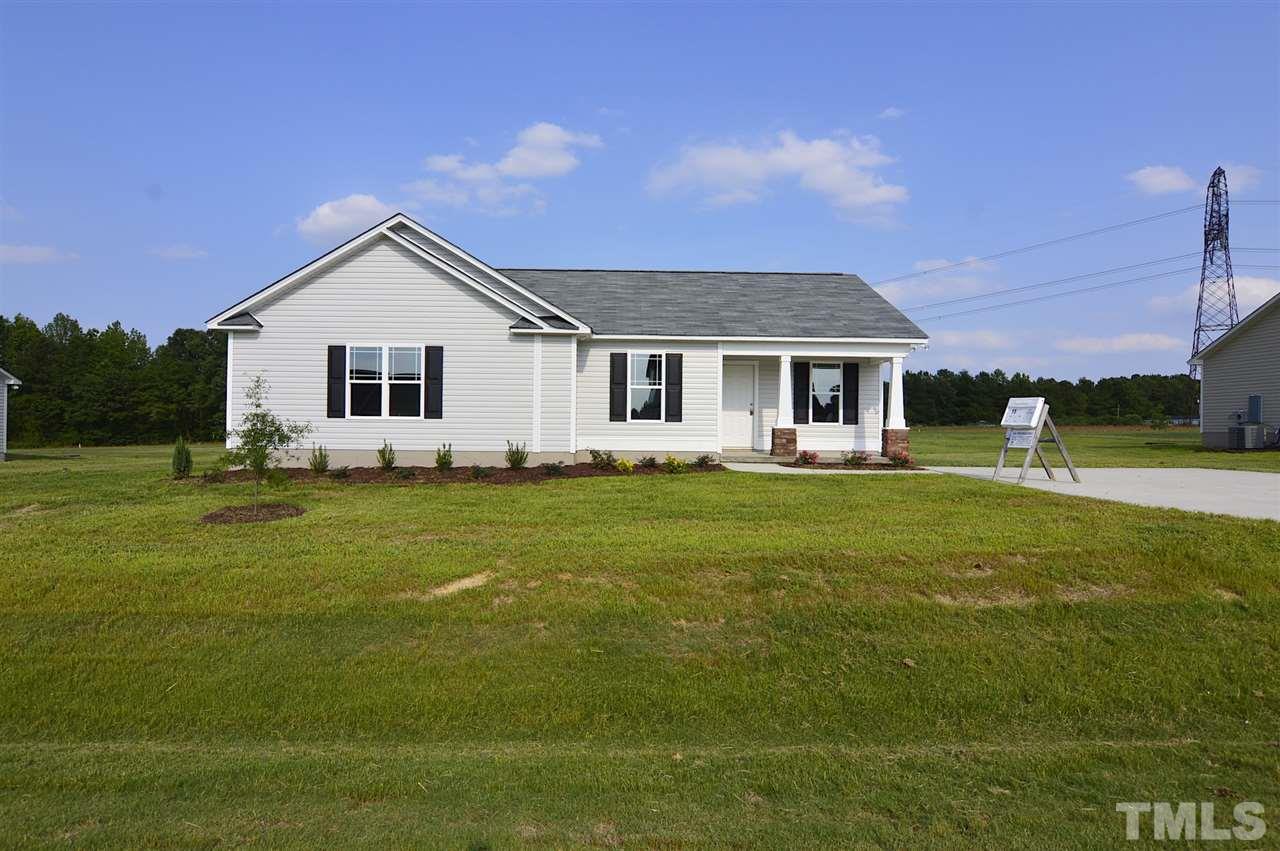 92 Willow Ridge Circle Willow Spring, NC 27592 - Photo 2 of 16 a front view of house with yard and green space