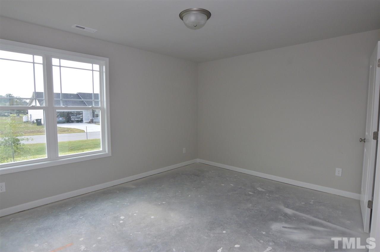 92 Willow Ridge Circle Willow Spring, NC 27592 - Photo 13 of 16 an empty room with a window