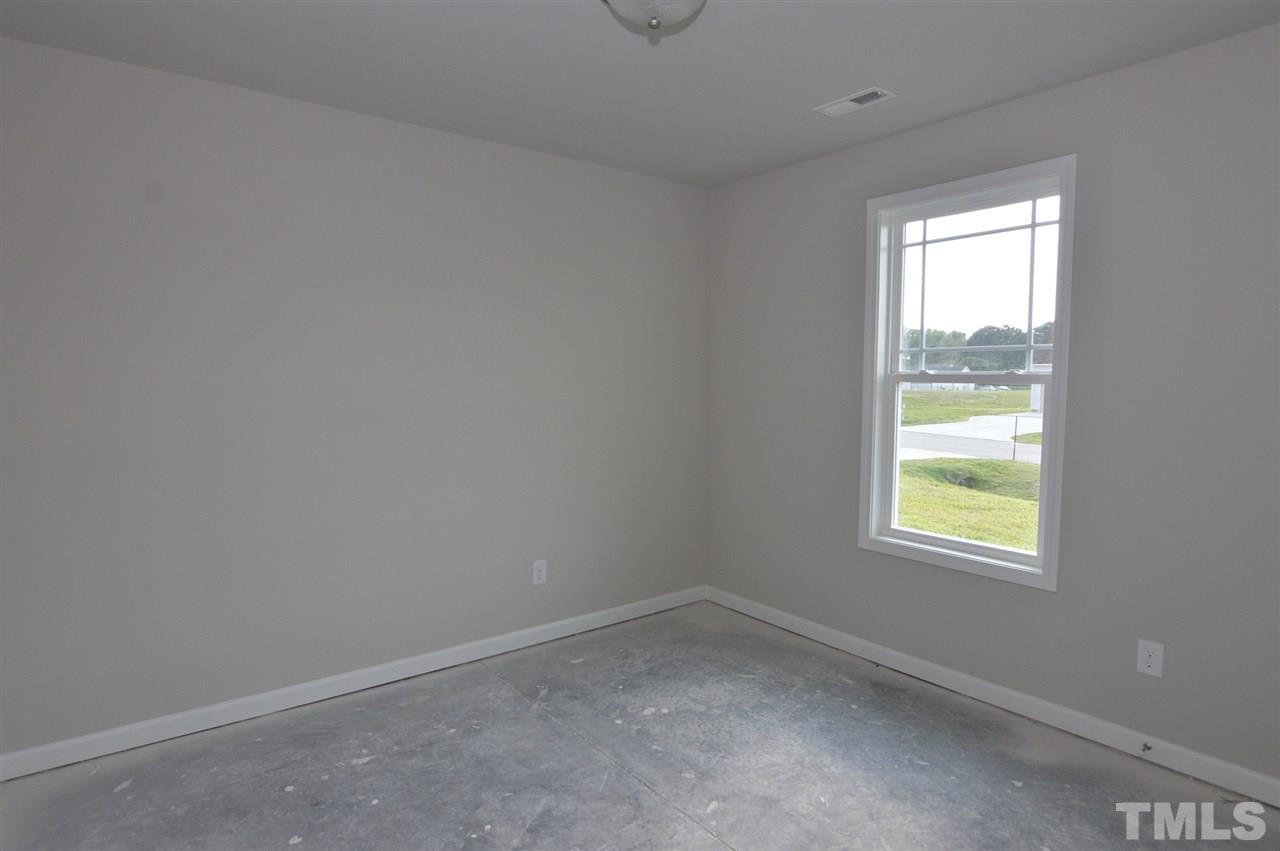 92 Willow Ridge Circle Willow Spring, NC 27592 - Photo 14 of 16 an empty room with a window
