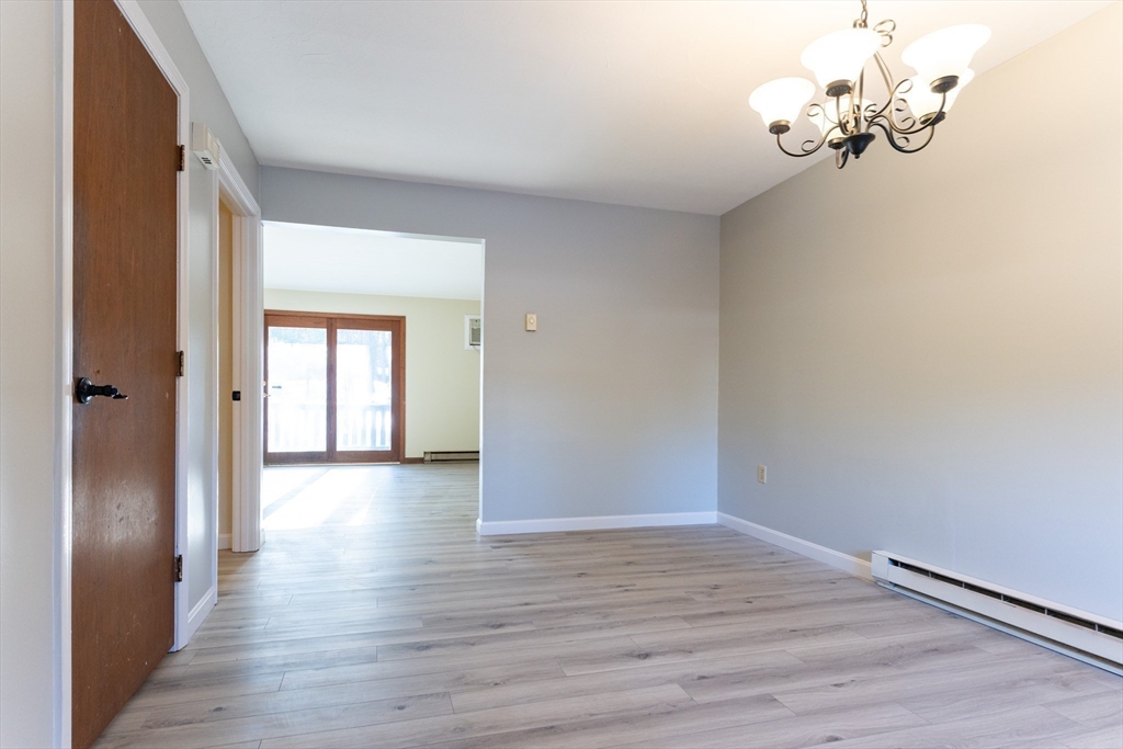 38 Drake Road, Unit 38 Fitchburg, MA 01420 - Photo 11 of 31 a view of a hallway with wooden floor